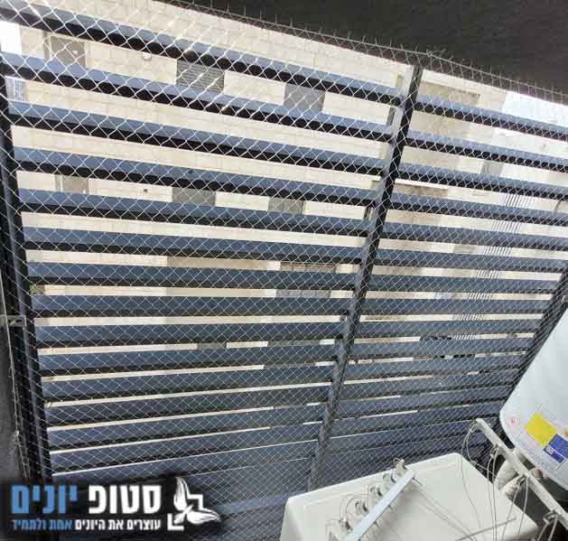 הרחקת יונים ממסתור כביסה